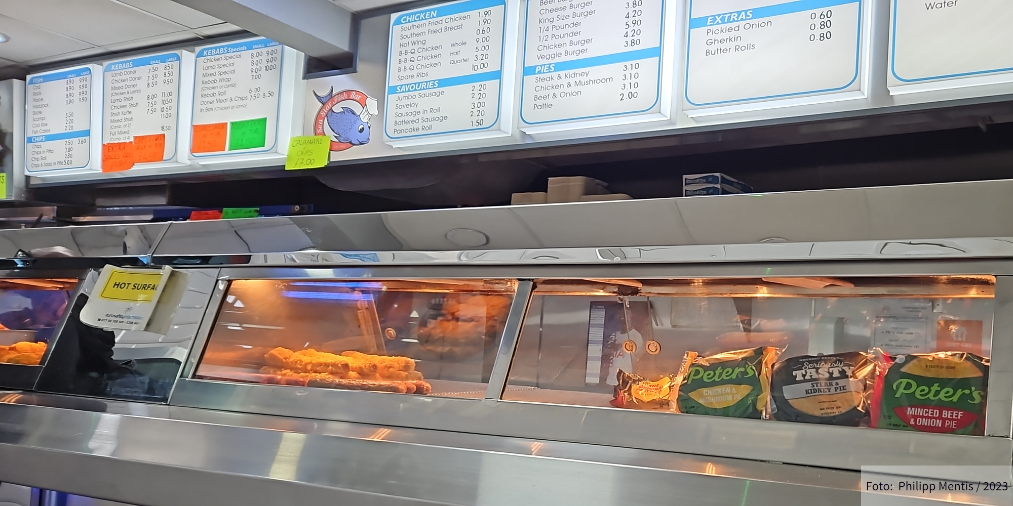 !B Counter with fried fish, minced beef and chips at Sea Star Fish Bar in Tottenham.