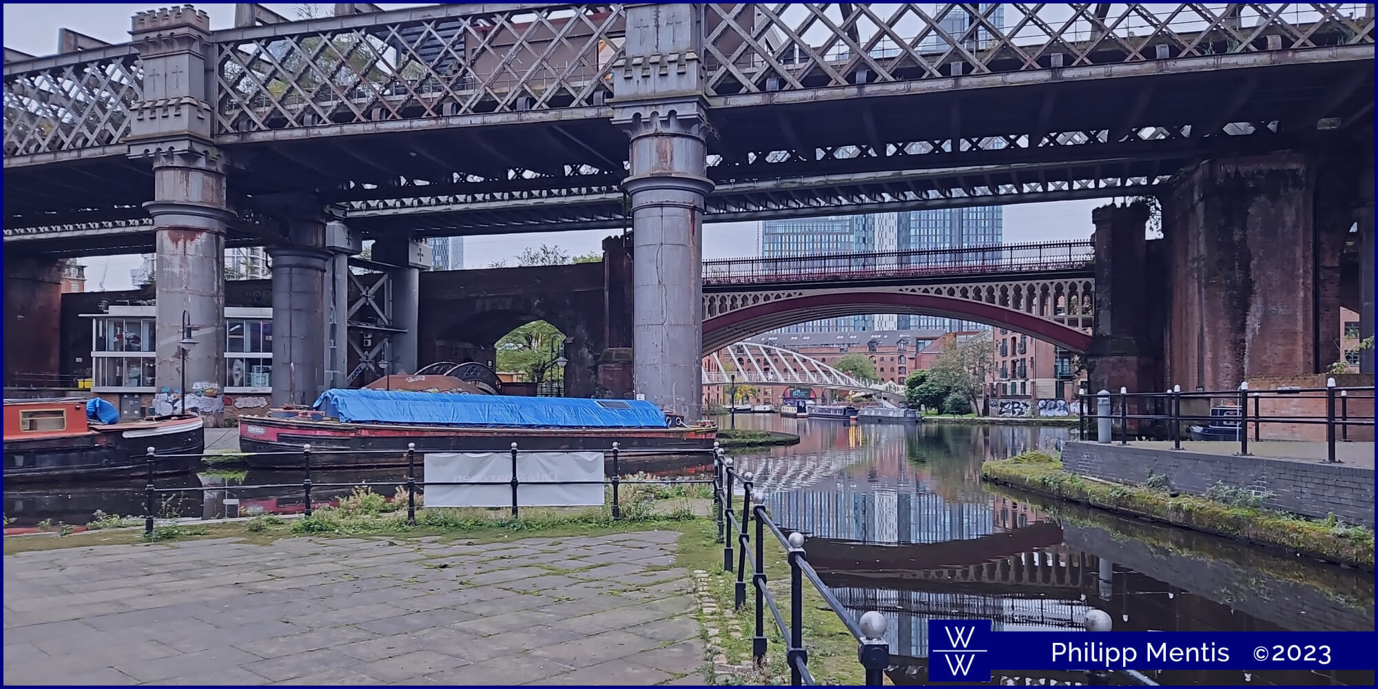 !B View of a Manchester canal system with various highline bridges crossing.