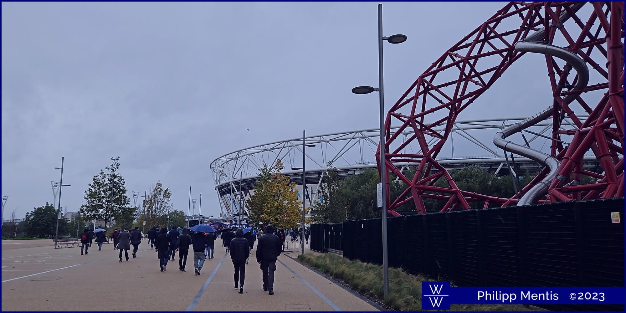 !B The path to London Stadium, with its silhouette looming in the background.