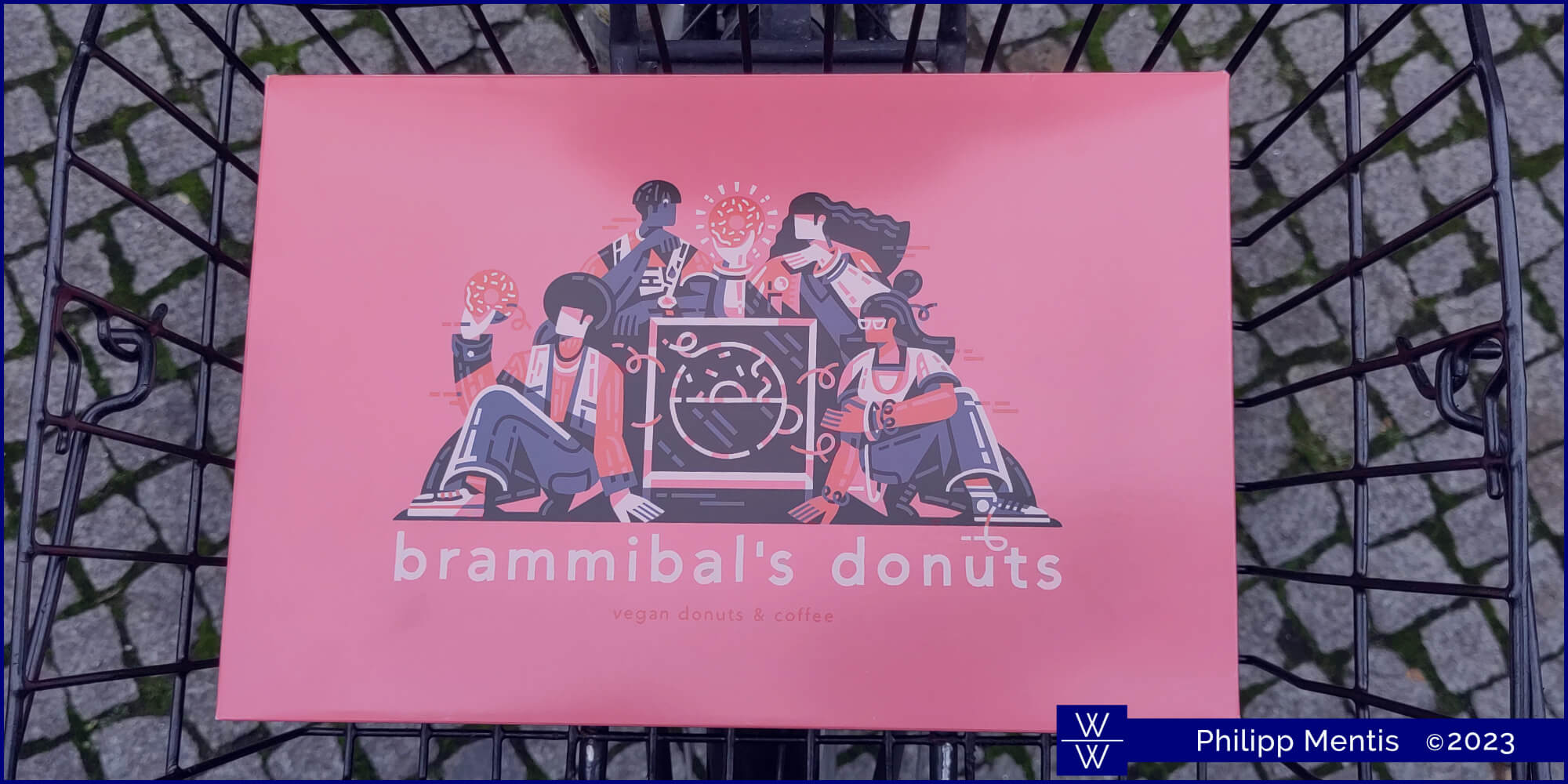 !B A six-piece donut box from Brammibal's lying in a bike basket.